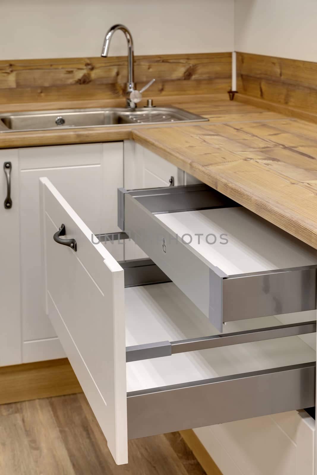 a kitchen interior with drawers by sveter