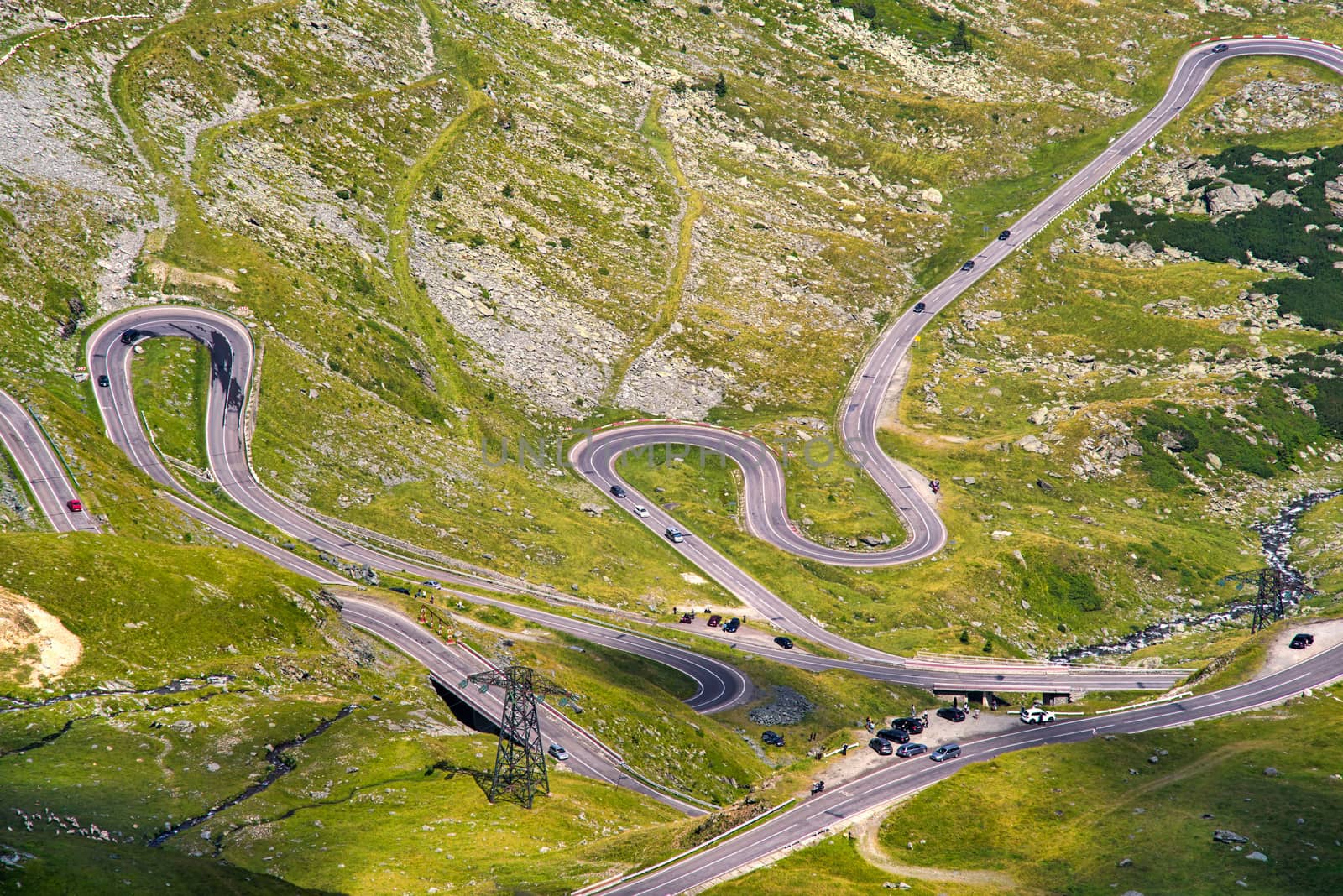 Many cars on Transfagarasan highway road in the summer, Fagaras Mountains in Romania