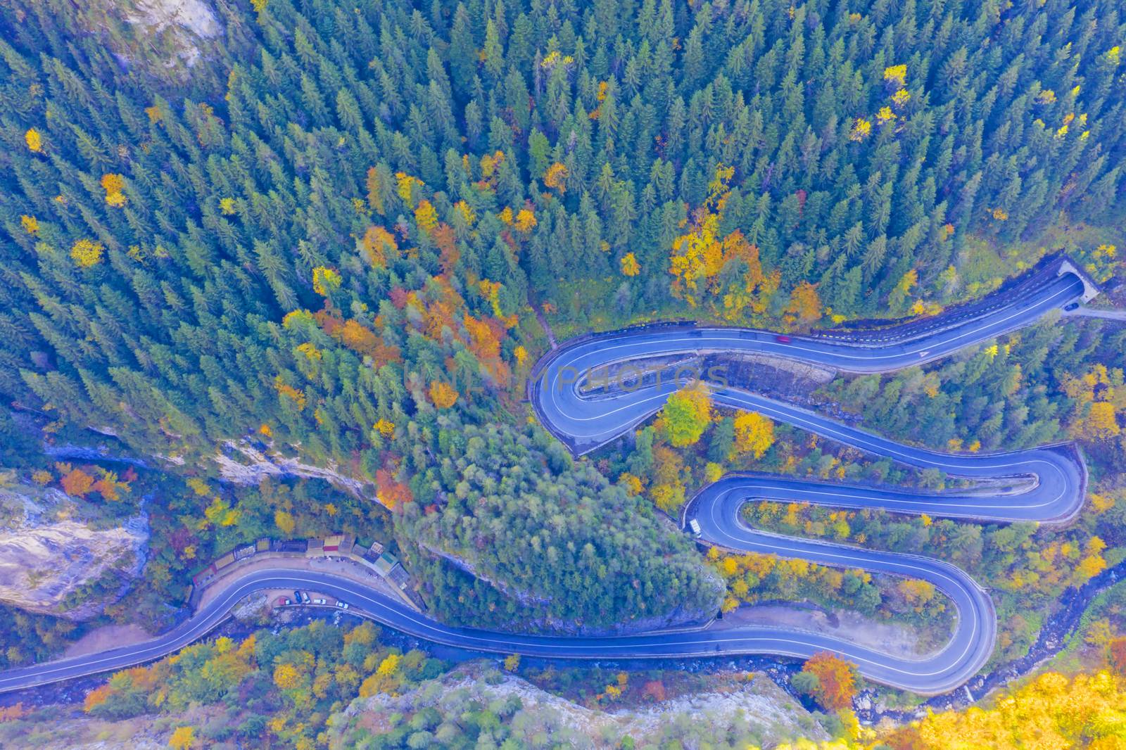 Above view of curvy mountain road in Romanian Carpathians. Bicaz Gorges are a mountain pass between two historic region in Romania.