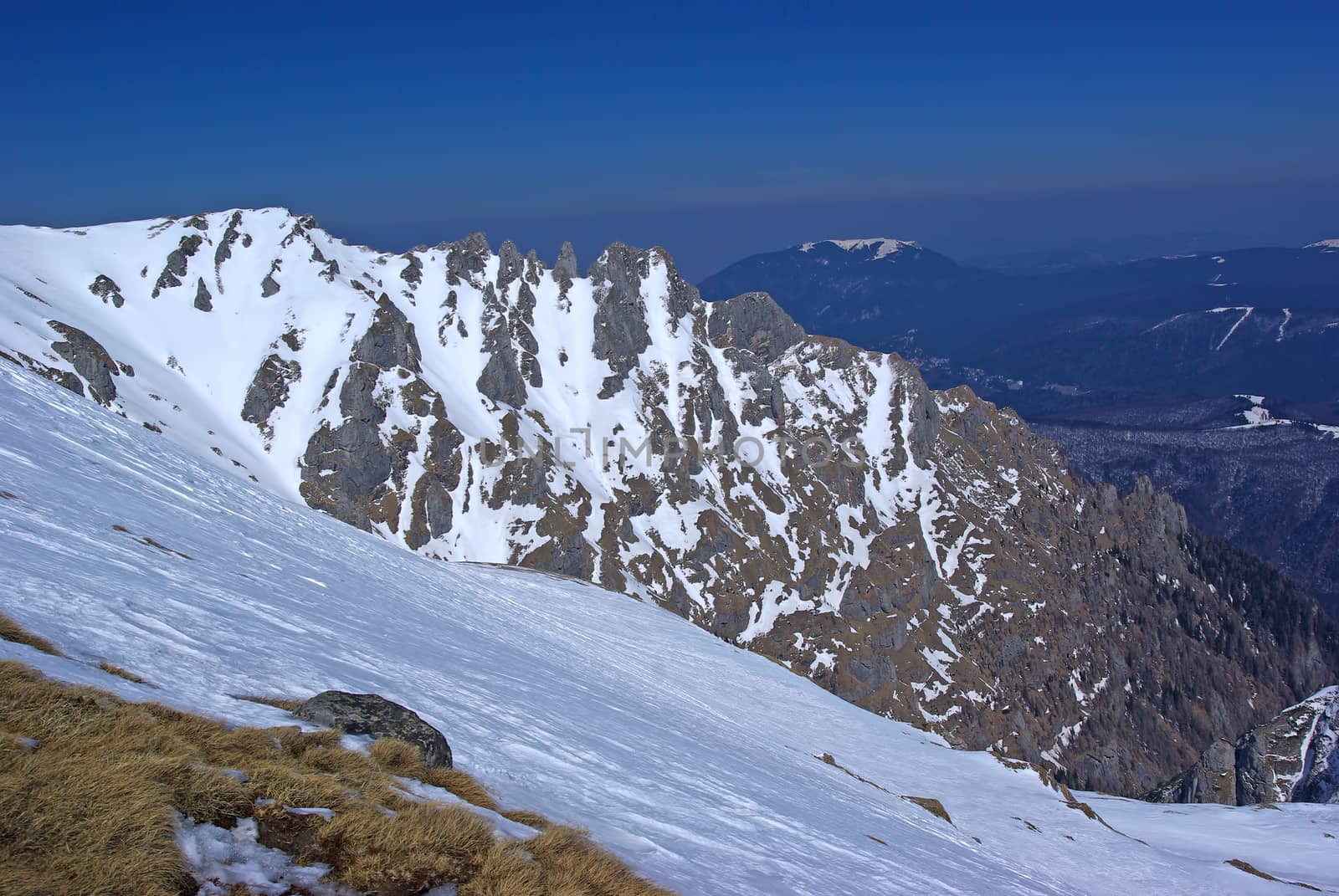Rock mountain crest, winter scene in Romanian Carpathians.