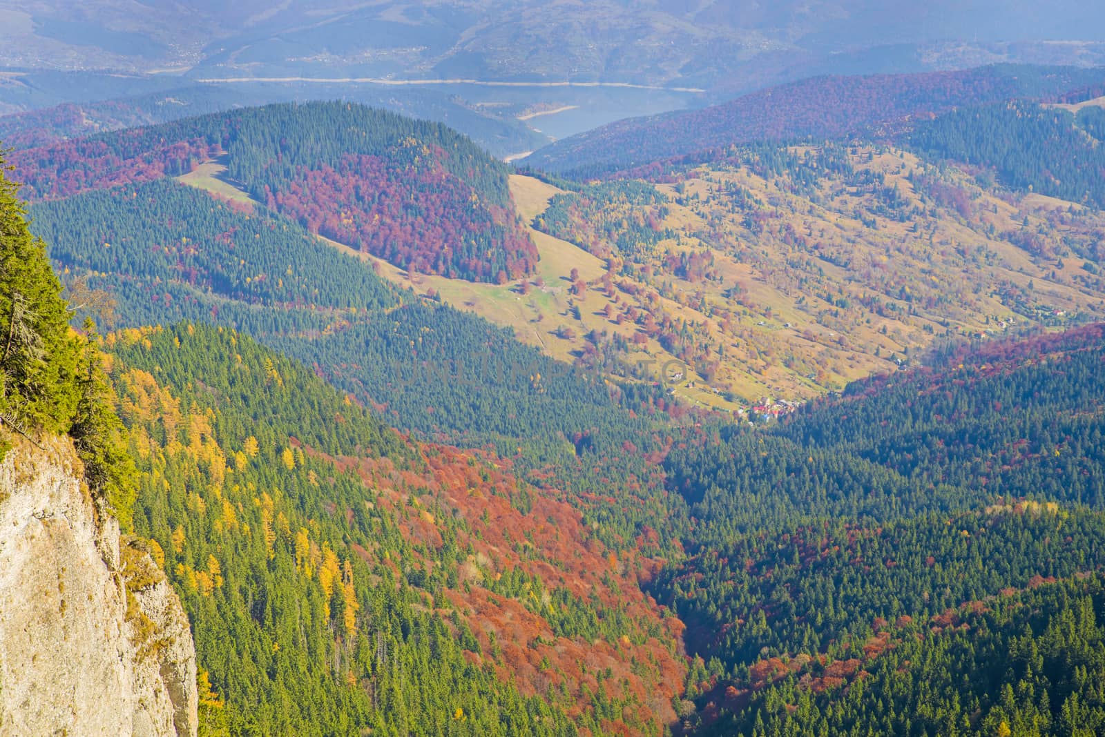 Autumn aerial landscape from the mountain, colored forest and valley scene