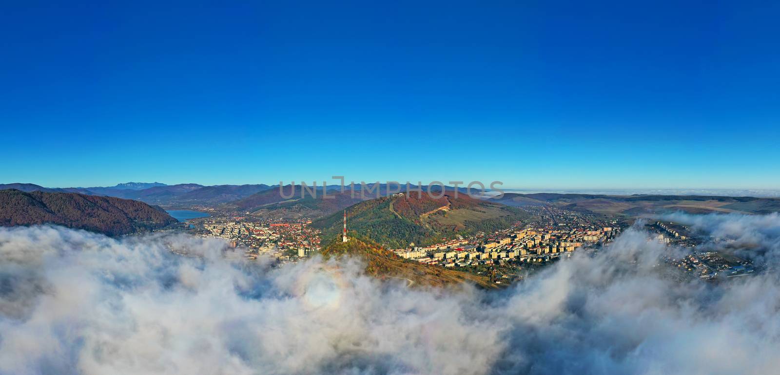 Aerial panorama of Piatra Neamt in Romania, autumn landscape in a foggy morning