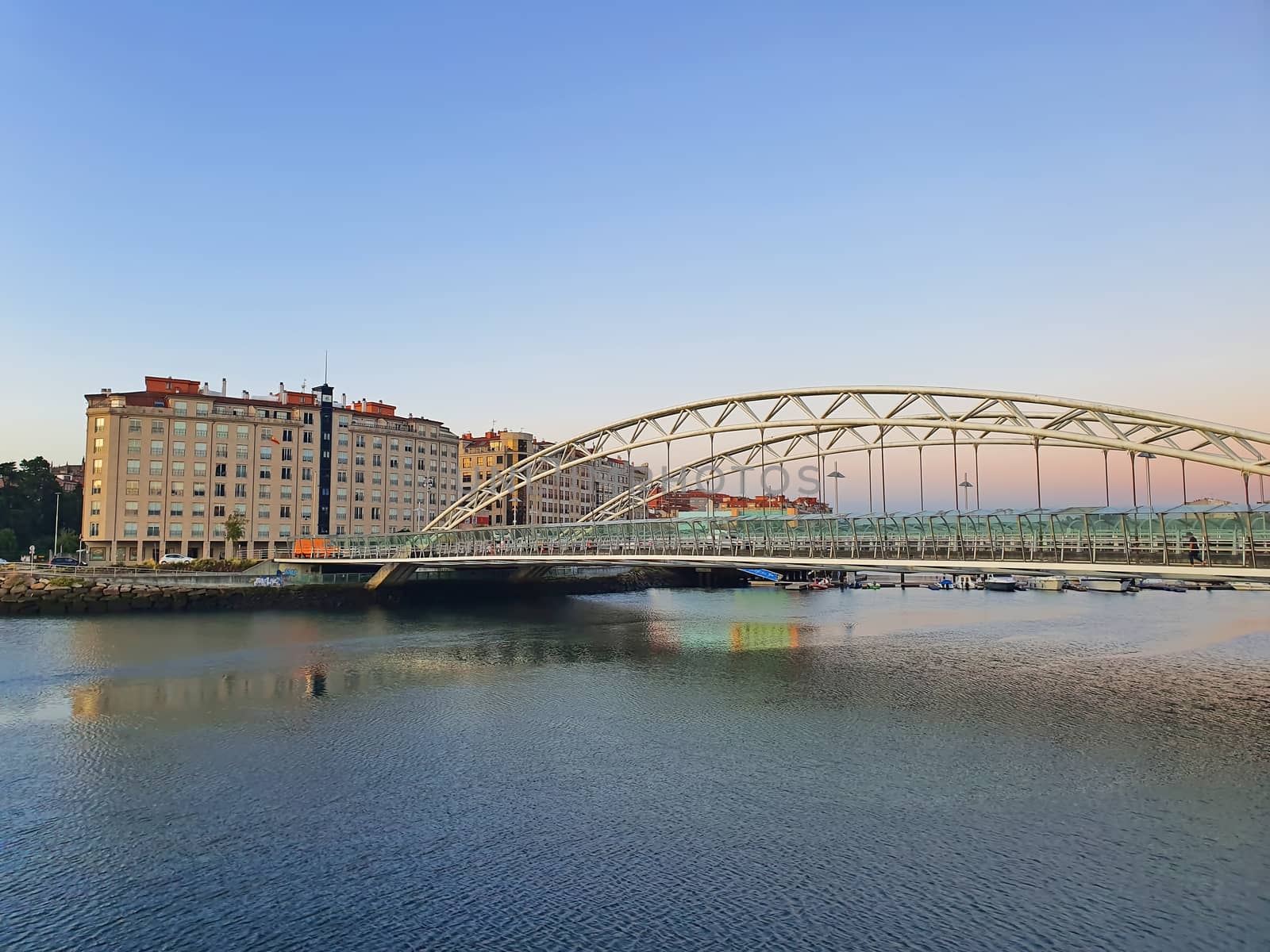 Arch bridge in Pontevedra, Currents Bridge in Spain, urban sunset landscape at Lerez river