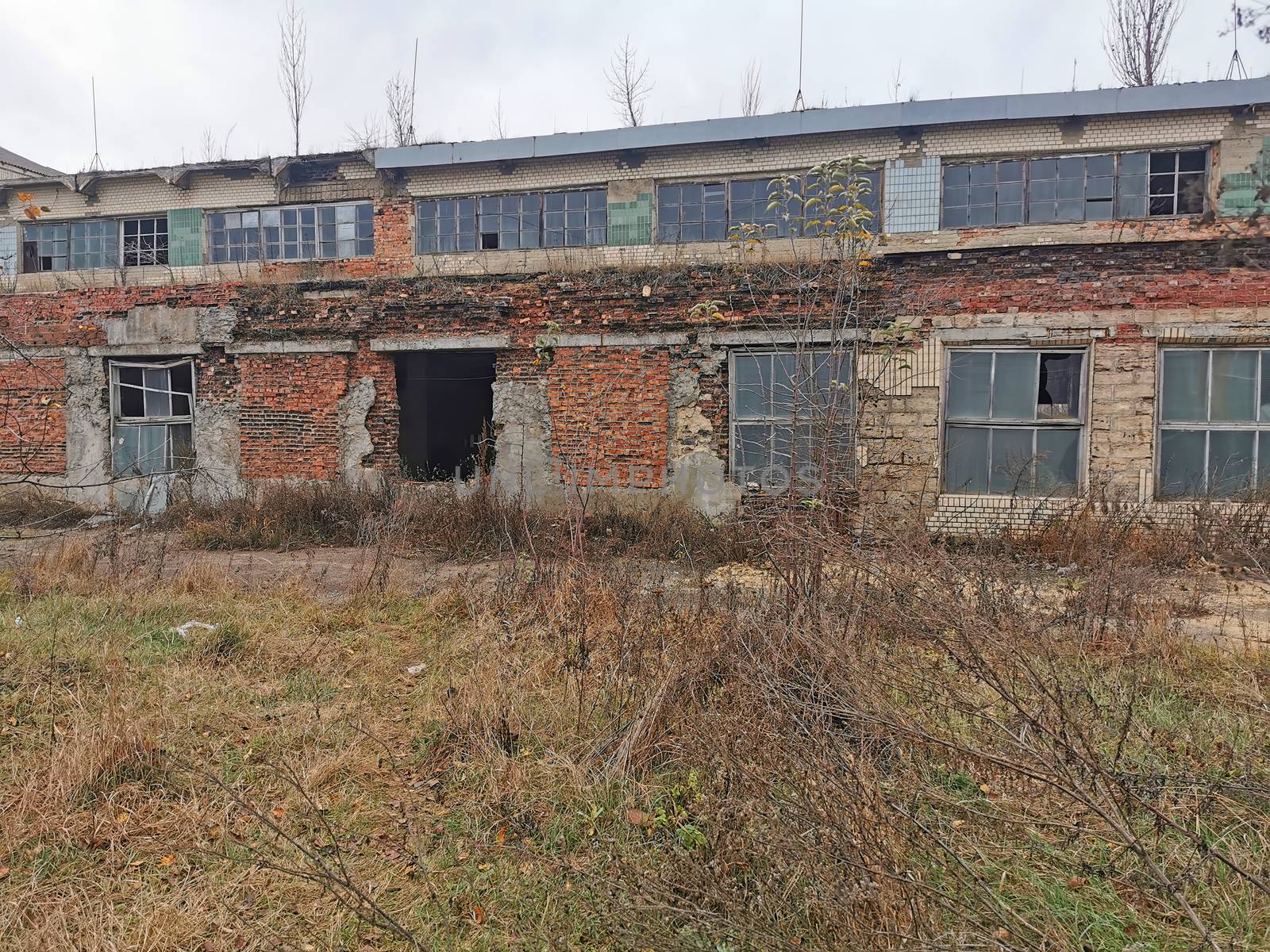 Abandoned old and dirty factory ruin, outside building view