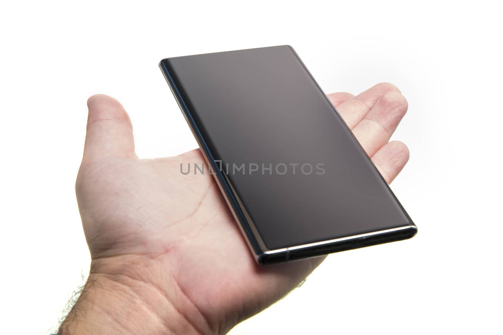 Hand held generic mobile phone over white, black smartphone