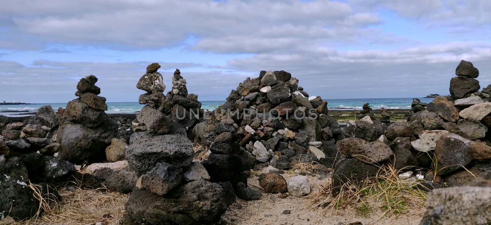 Wish rock blocks made by people on the shore of a beach by mshivangi92