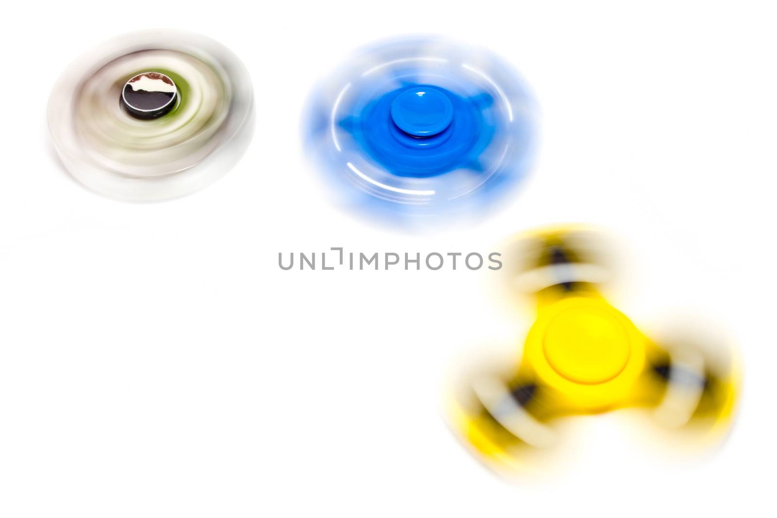 fidget hand spinner spinning on white background by Satakorn