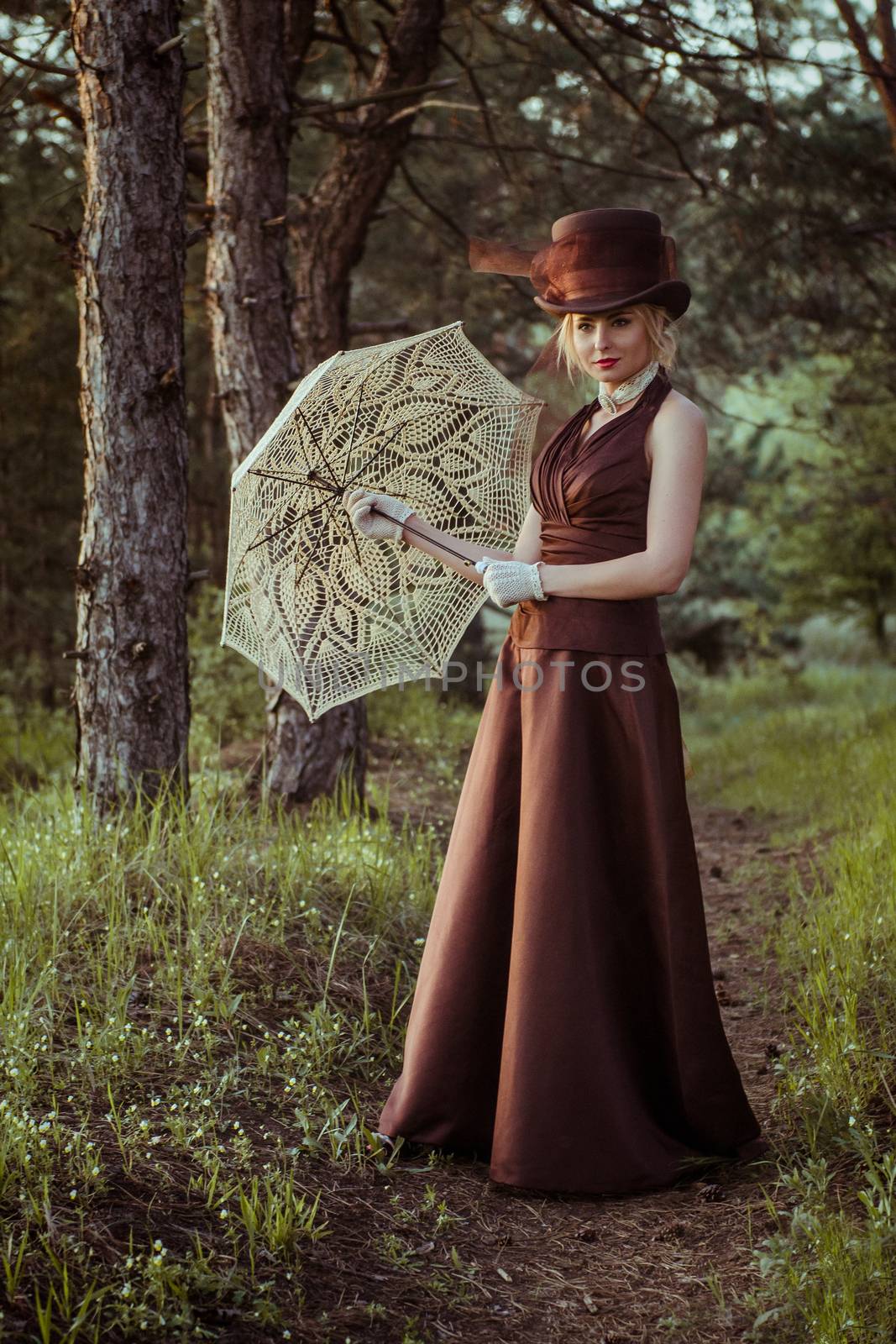 young blonde girl in a brown vintage dress and top hat by Andreua