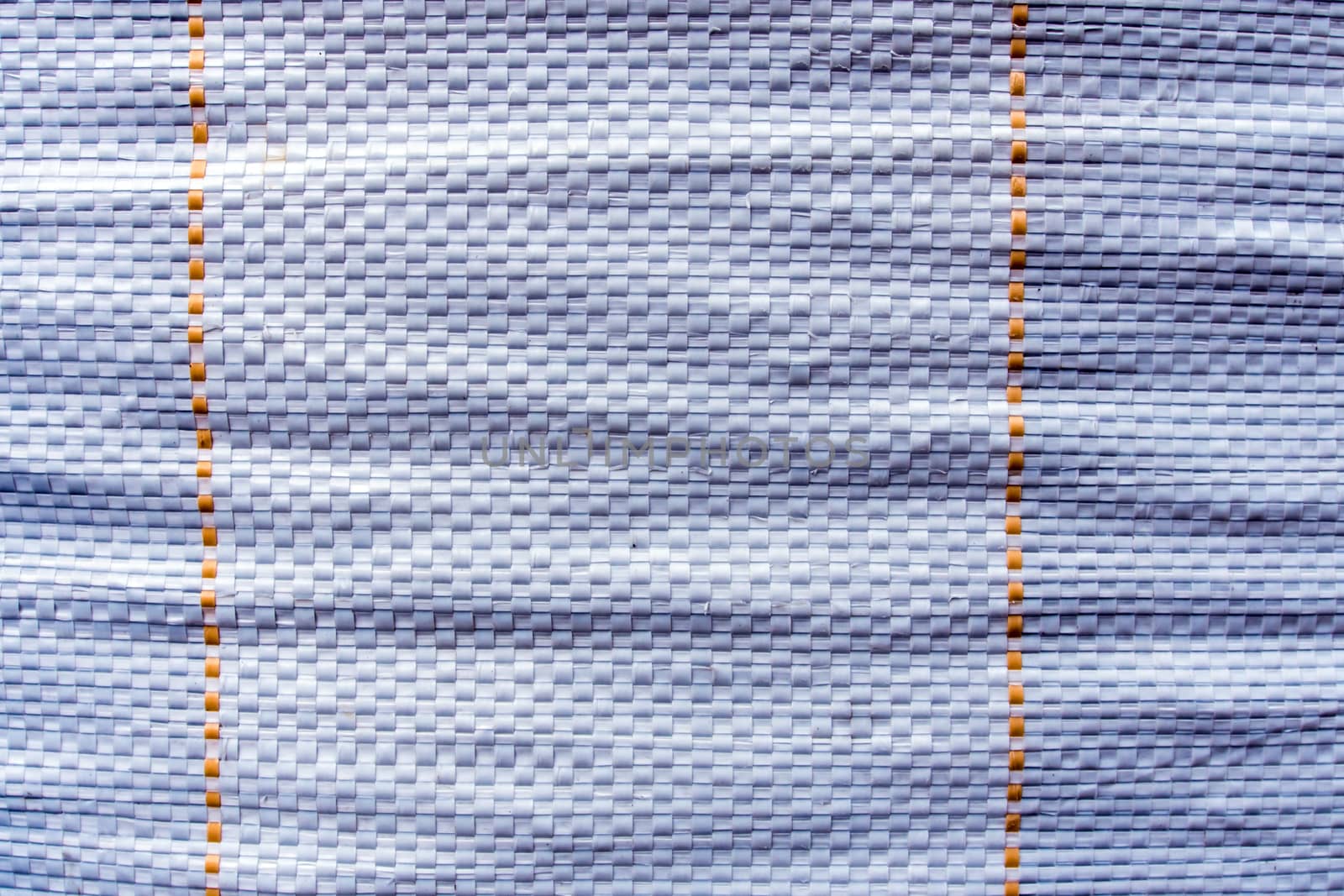 Surface texture of old and tear white plastic woven bag