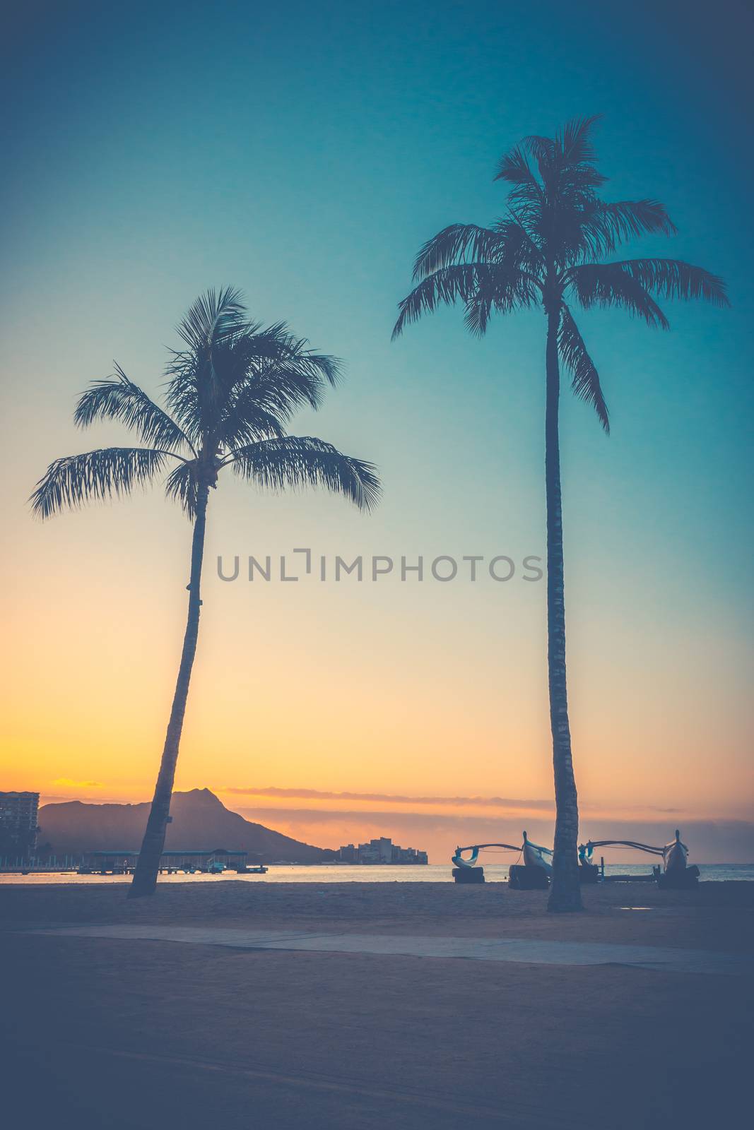 Retro Style Sunrise Over Waikiki Beach In Hawaii With Palm Trees