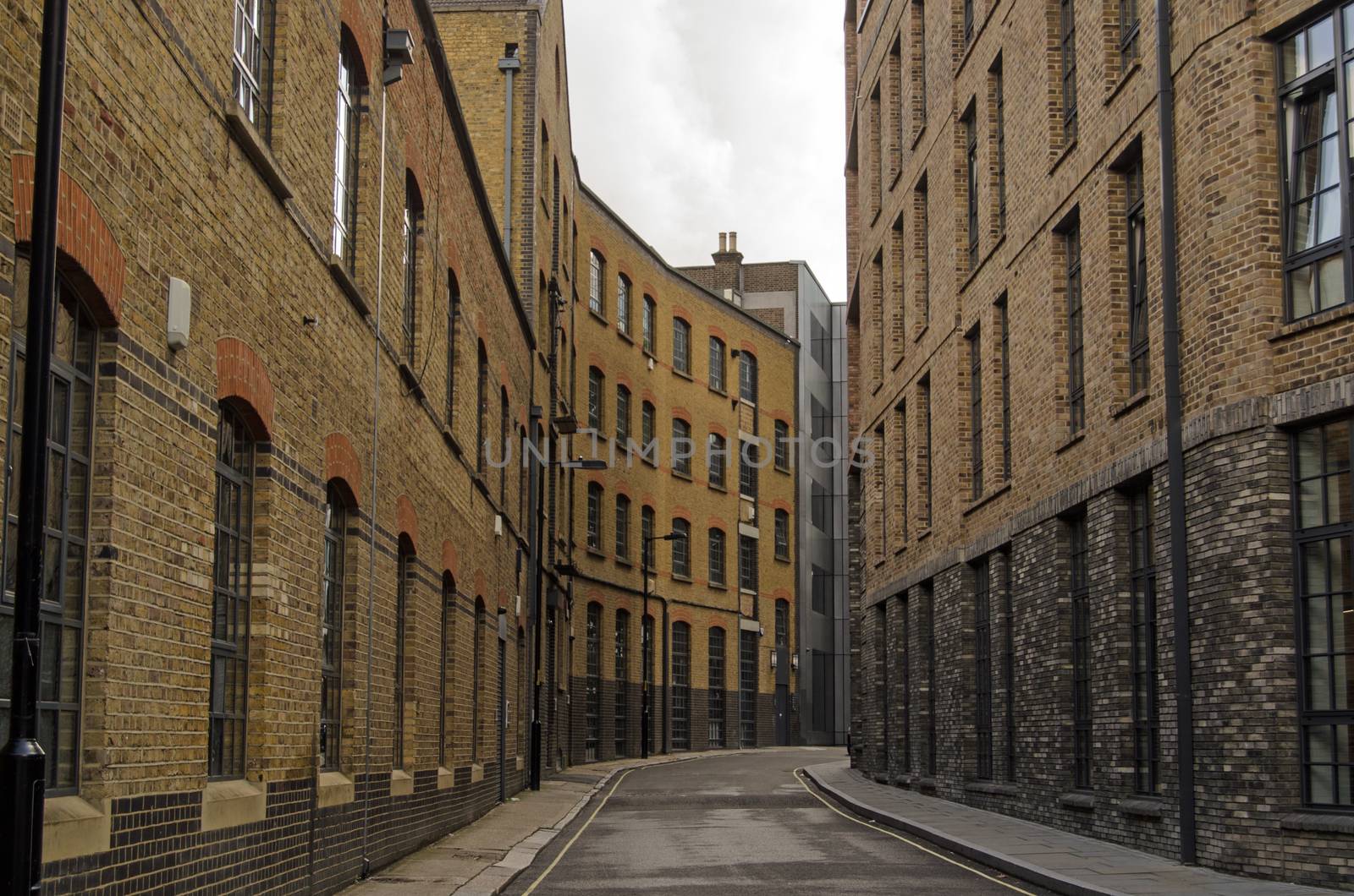 Historic, narrow street in Southwark, London.  Valentine Place has existed since the 18th century and was overtaken by the current warehouse and factory buildings in late Victorian times. 