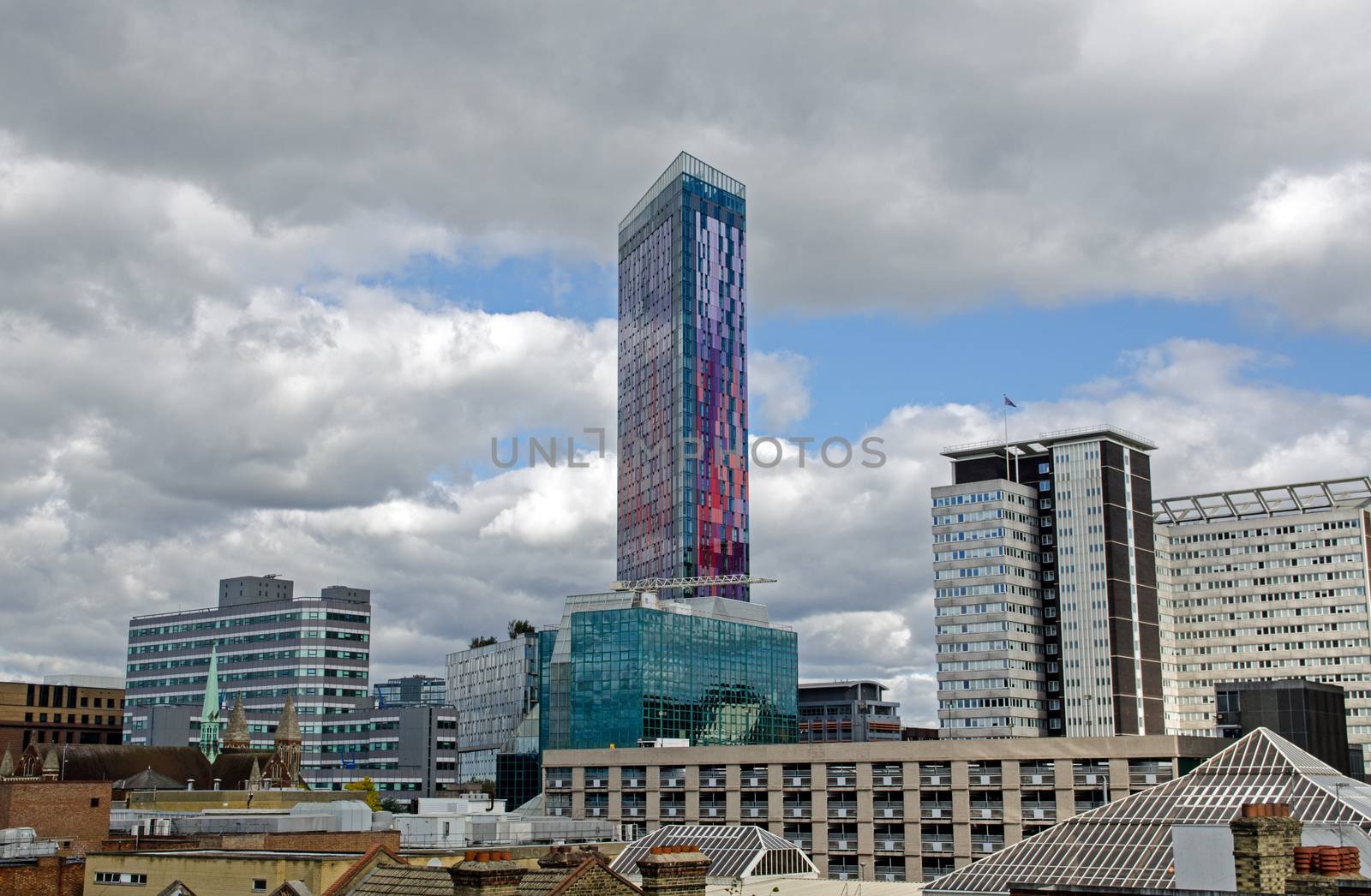 The landmark Saffron Tower with distinctive purple and red cladding in the middle of Croydon, South London.
