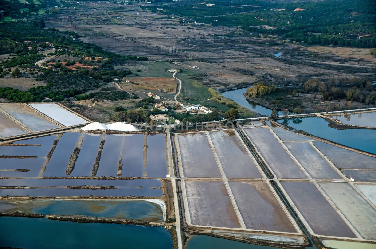Salt producing evaporation ponds, Faro, Portugal by BasPhoto