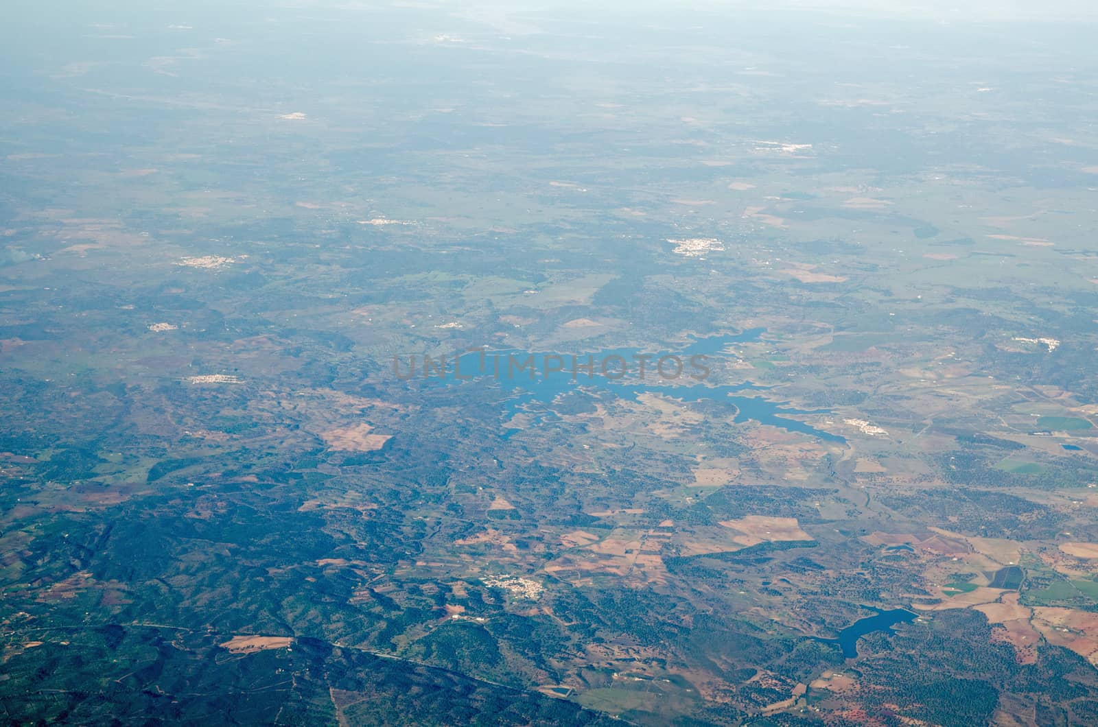 View from the air of the Albergaria Dos Fusos dam and reservoir in Cuba, Portugal.  Spreading over the border betwen the Evora and Beja districts, the water supplies the town of Viana Do Alentejo and other local areas.  