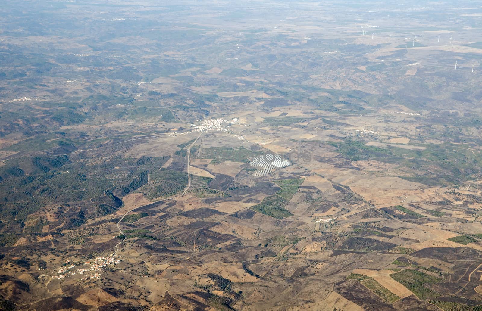 Aerial view of the town of Martim Longo in the Alcoutim region of Portugal.  The area is supplied with renewable energy with a large solar farm and many wind turbines nearby.  