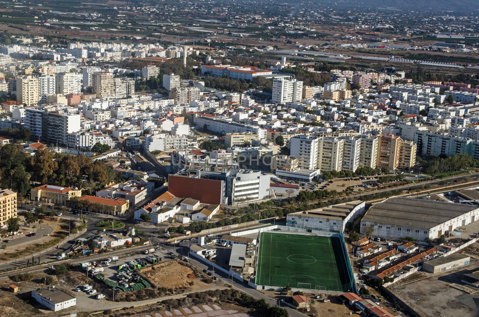 Aerial view of Faro on the Algarve Coast of Portugal with the Escola de Futebol, football school to the foreground.
