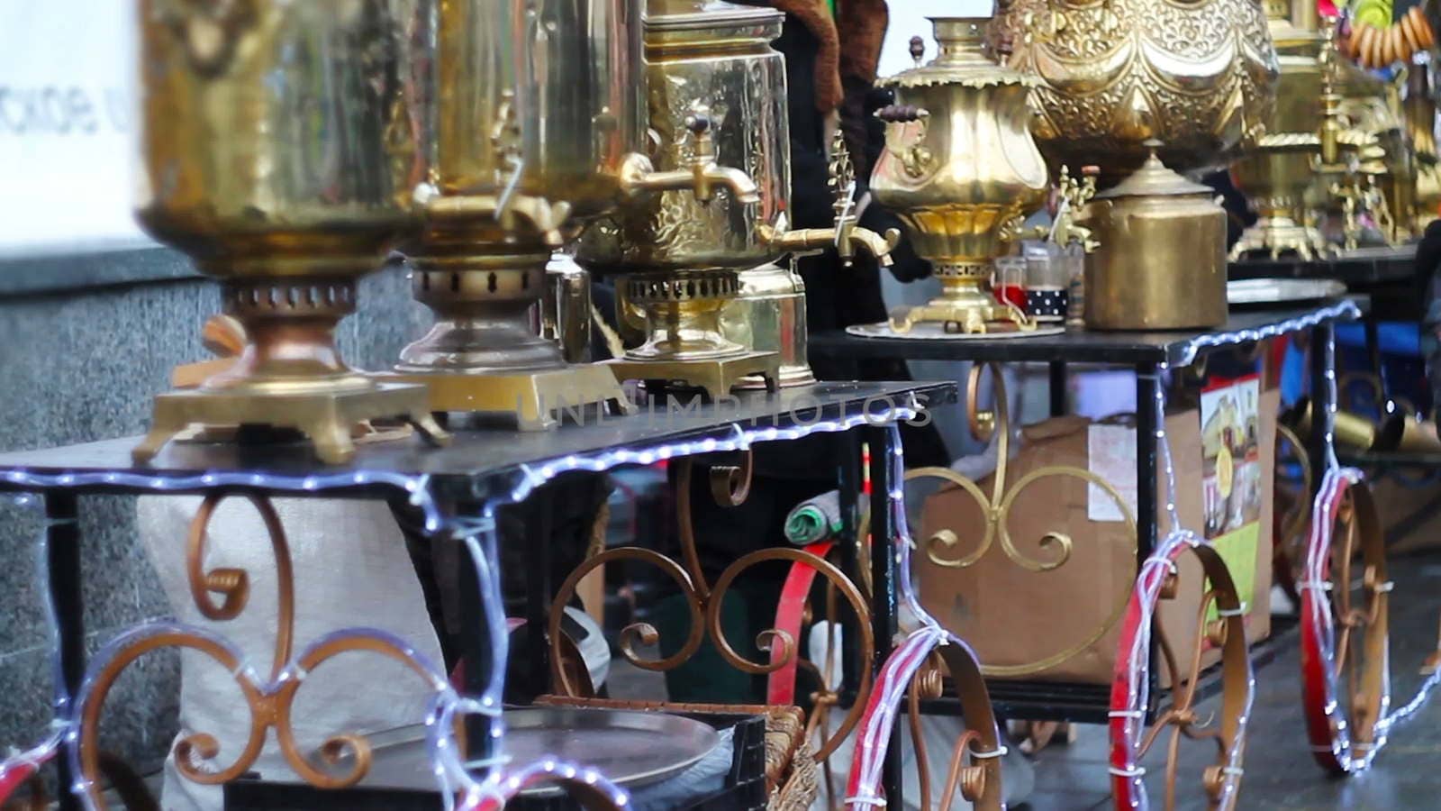 many brilliant metal samovars at the celebration of the city holiday.