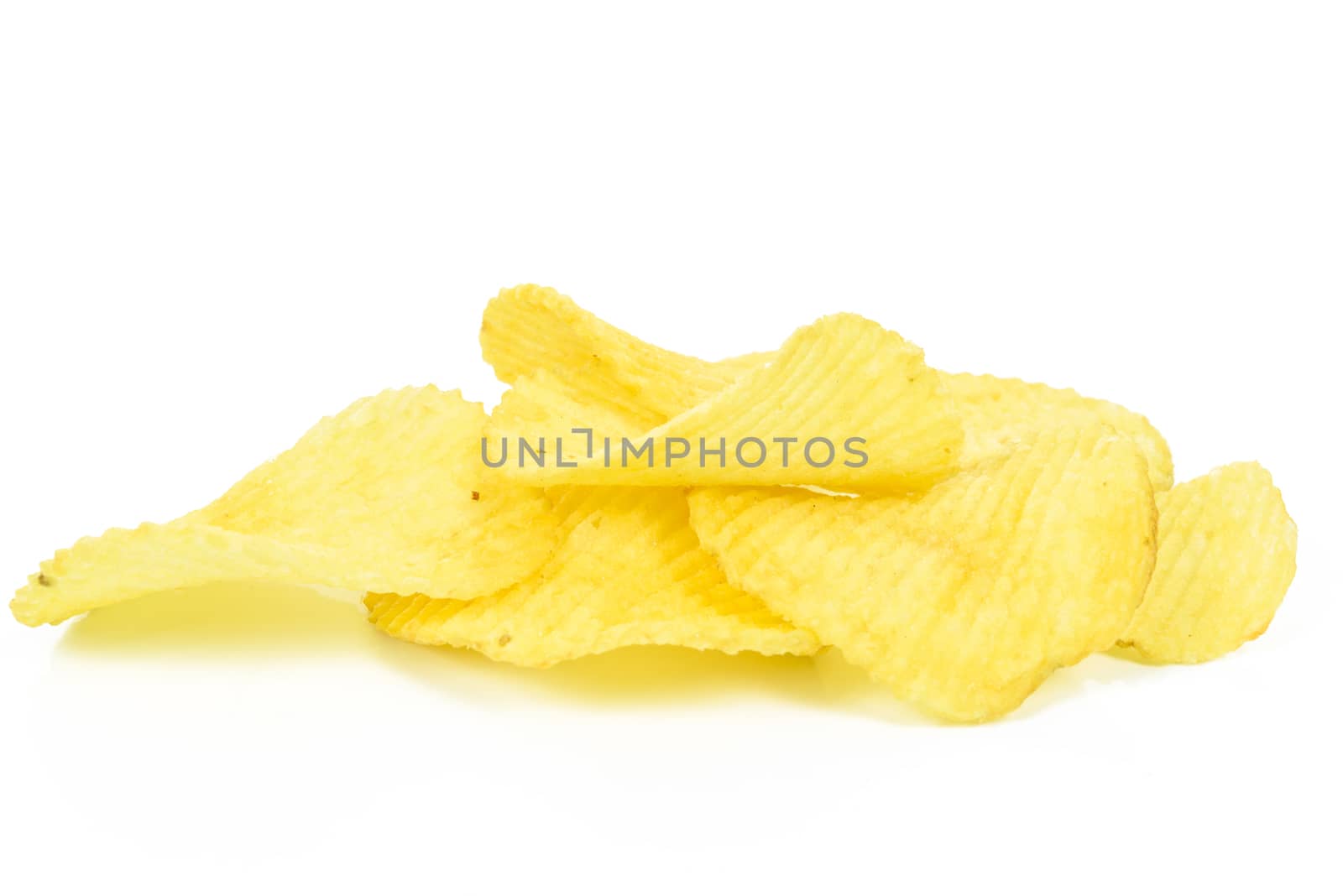 Group of crispy potato chips in close-up isolated on a white background.