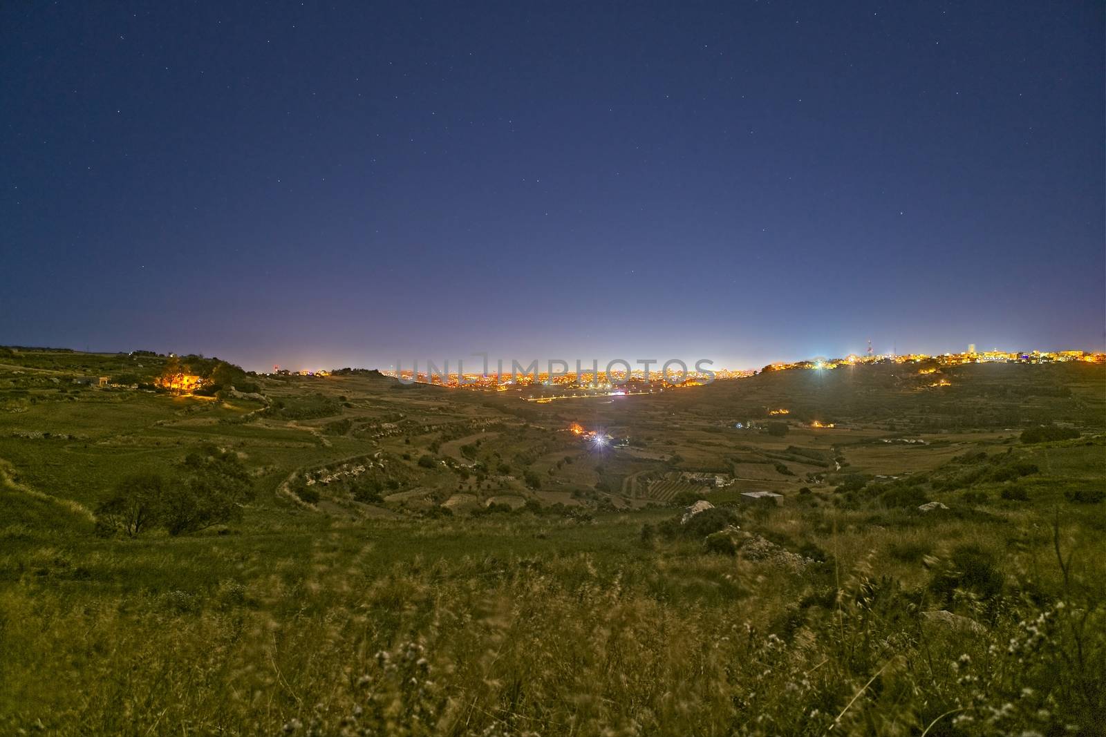 Panoramic night time view of Wied Qlejgha in Malta