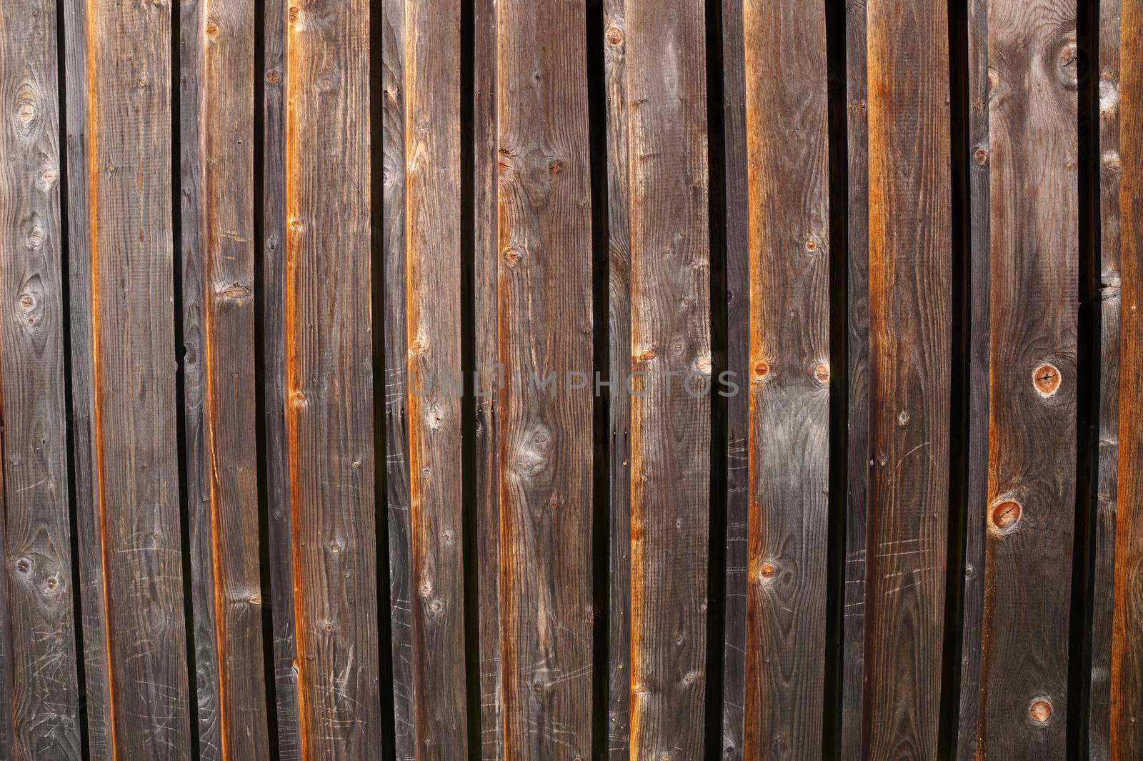 Decorative panel from wooden boards on a house wall