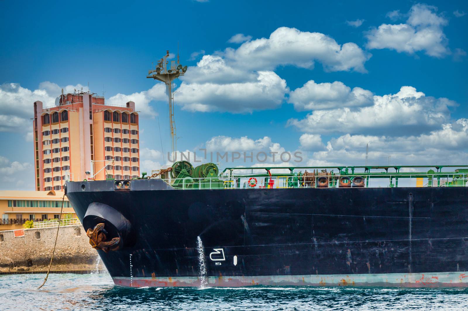 A massive tanker ship leaving the harbor on Curacao