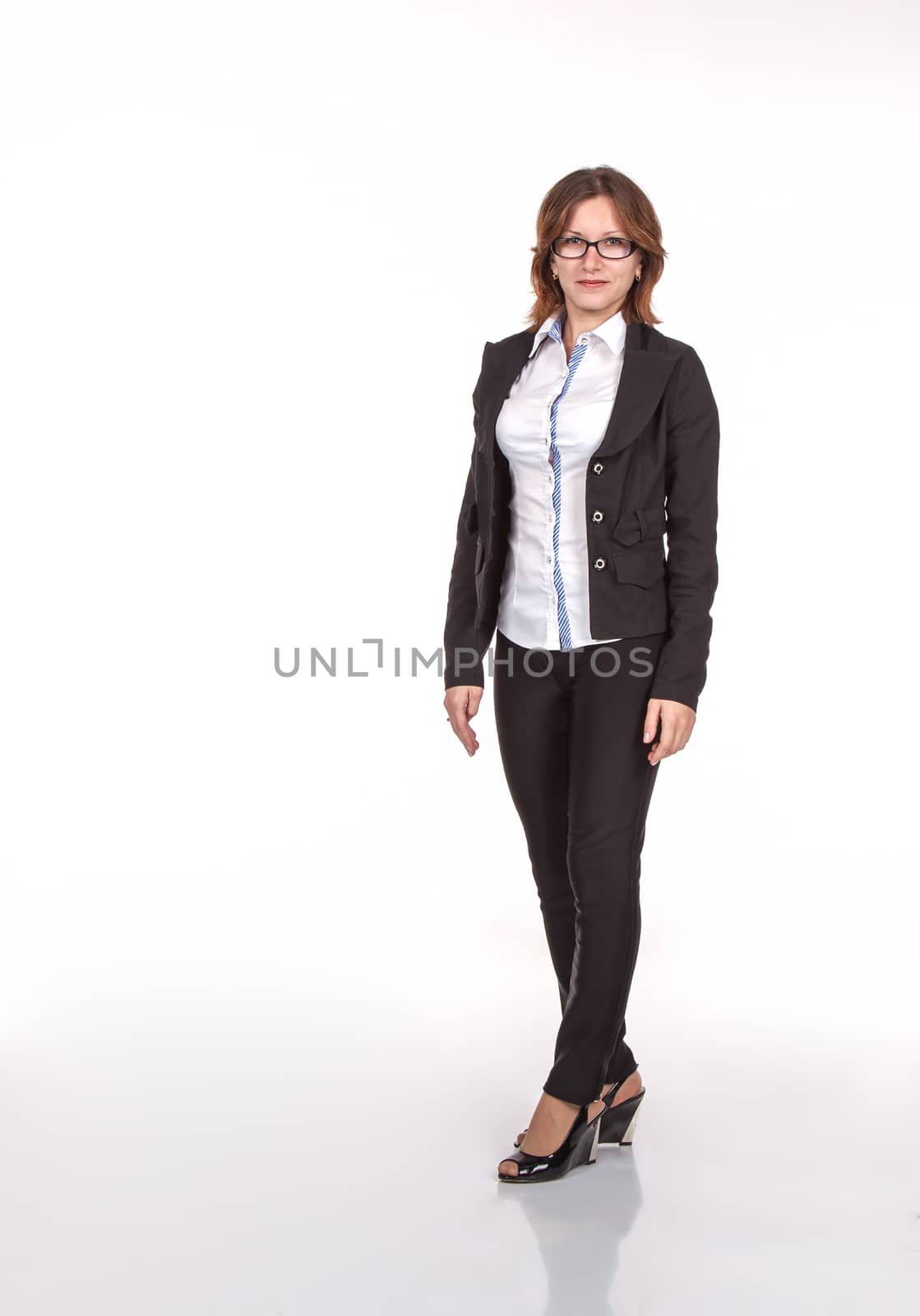 business woman in black suit and glasses standing in the office