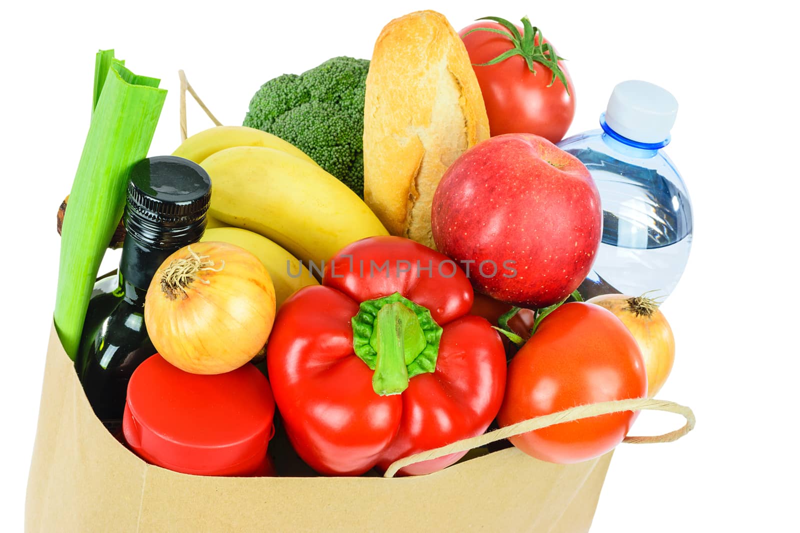 Grocery shopping concept image - Eco friendly paper shopping bag filled with various food products isolated on a white background