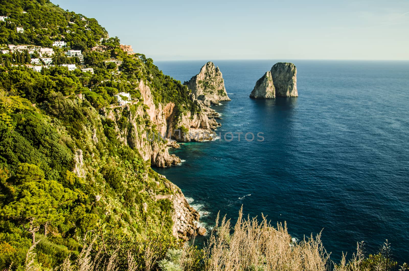 The Mediterranean sea on the Italian coast of the island of capri with its "faraglioni".