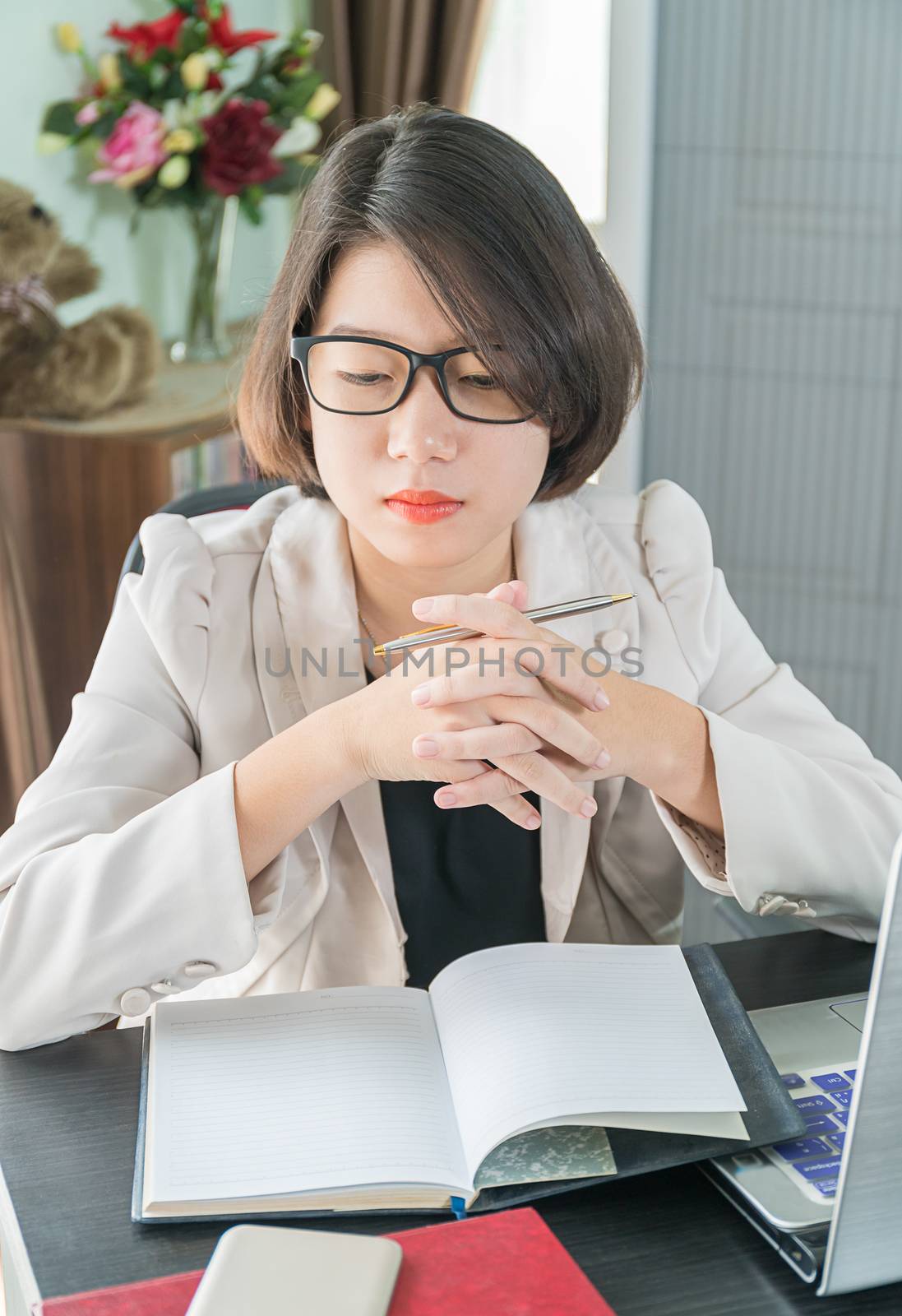 Teenage girl working on laptop in home office by stoonn