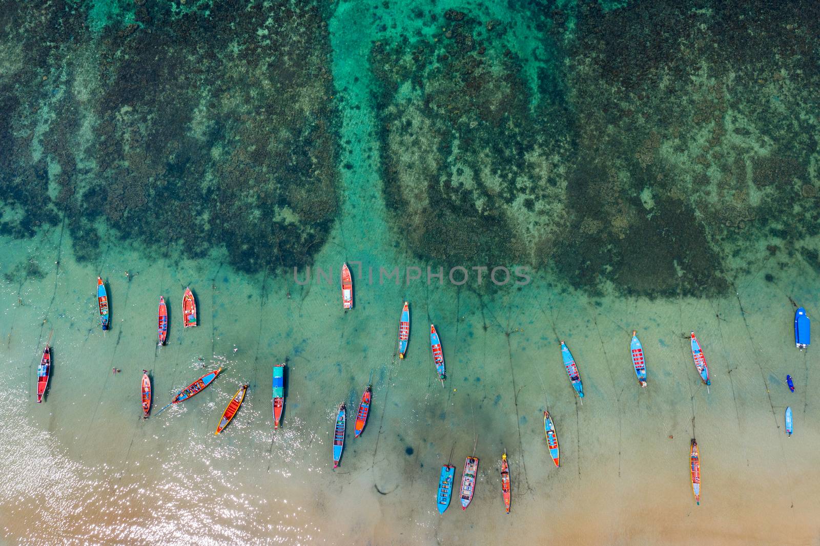 Aerial view of Long tail boats on the sea at Koh Tao island, Thailand. by gutarphotoghaphy