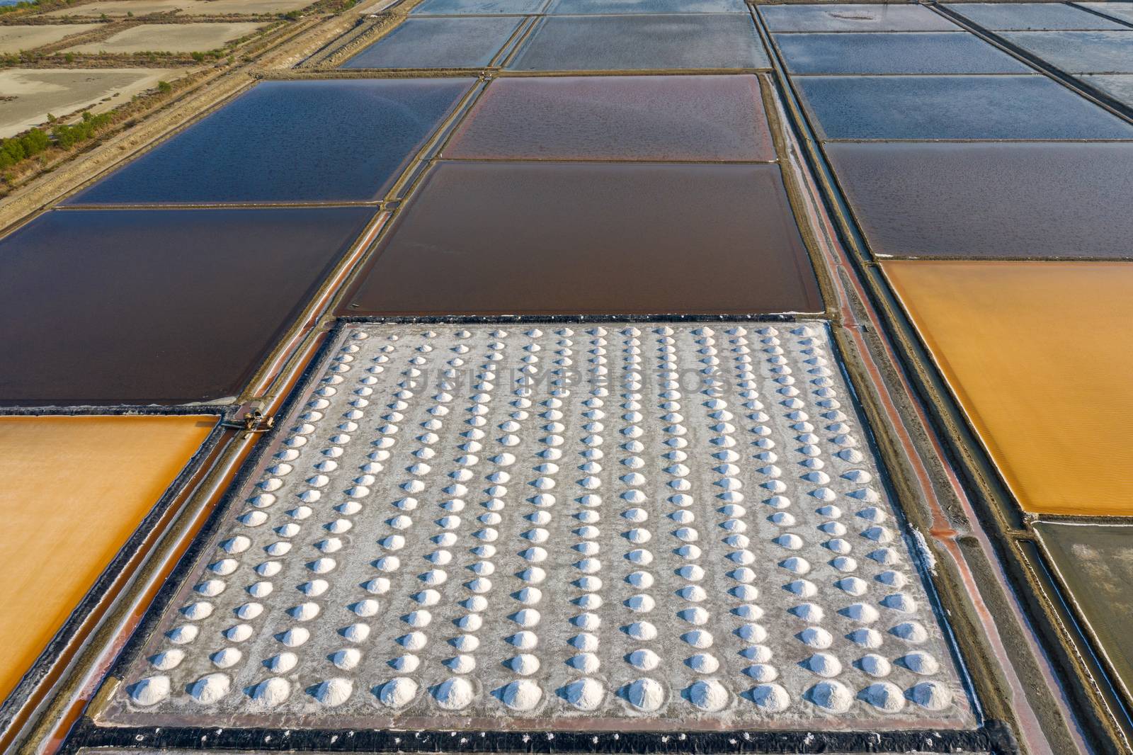 Aerial view of Salt in salt farm ready for harvest, Thailand. by gutarphotoghaphy