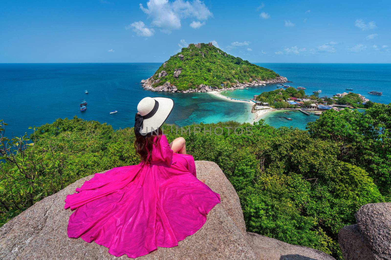 Beautiful girl sitting on viewpoint at Koh Nangyuan island near Koh Tao island, Surat Thaini in Thailand. by gutarphotoghaphy