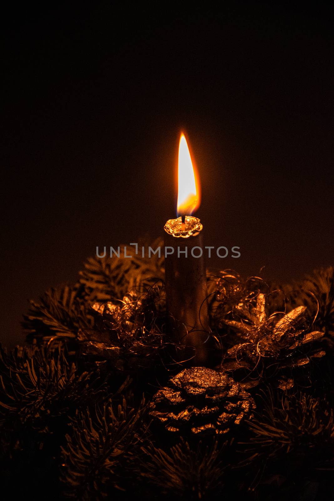 beautiful elegant Christmas headdress with a candle lit in the ambient lighting