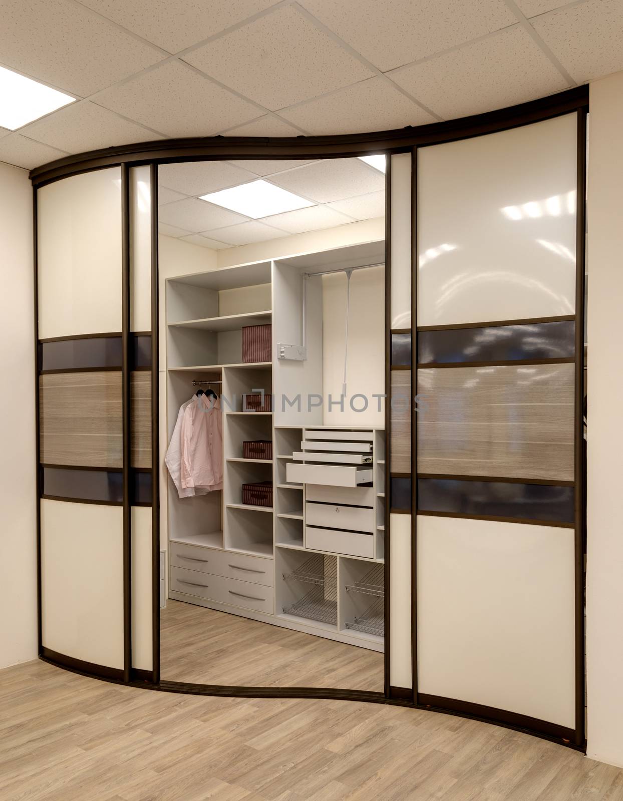 Empty wardrobe room with shelves, cabinets by sveter