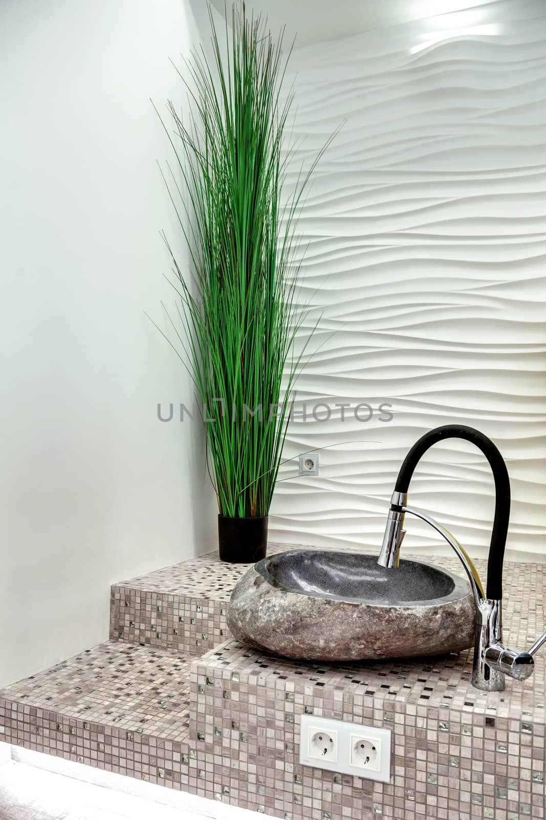 stone sink for pedicure on the floor