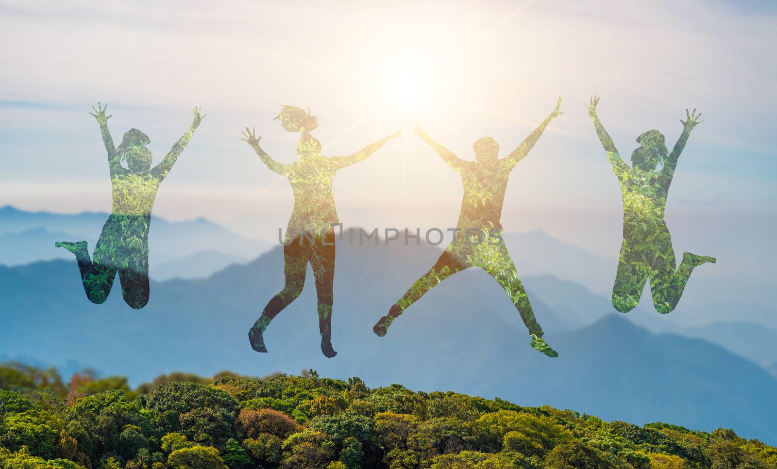 Young people are jumping with joy in the midst of the wild nature.concept Environmental day earth
