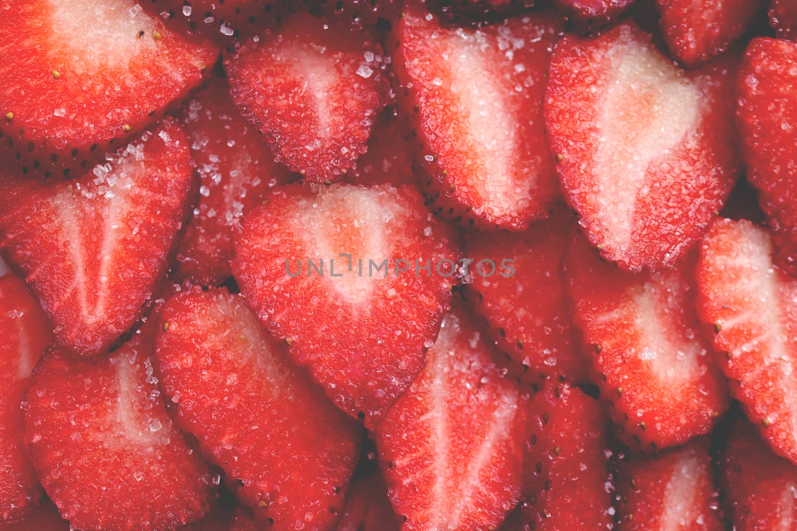 Fresh vitamin berry backdrop. Sliced strawberry in sugar filling background. Red healthy tasty strawberry’s with sugar texture. by sanches812