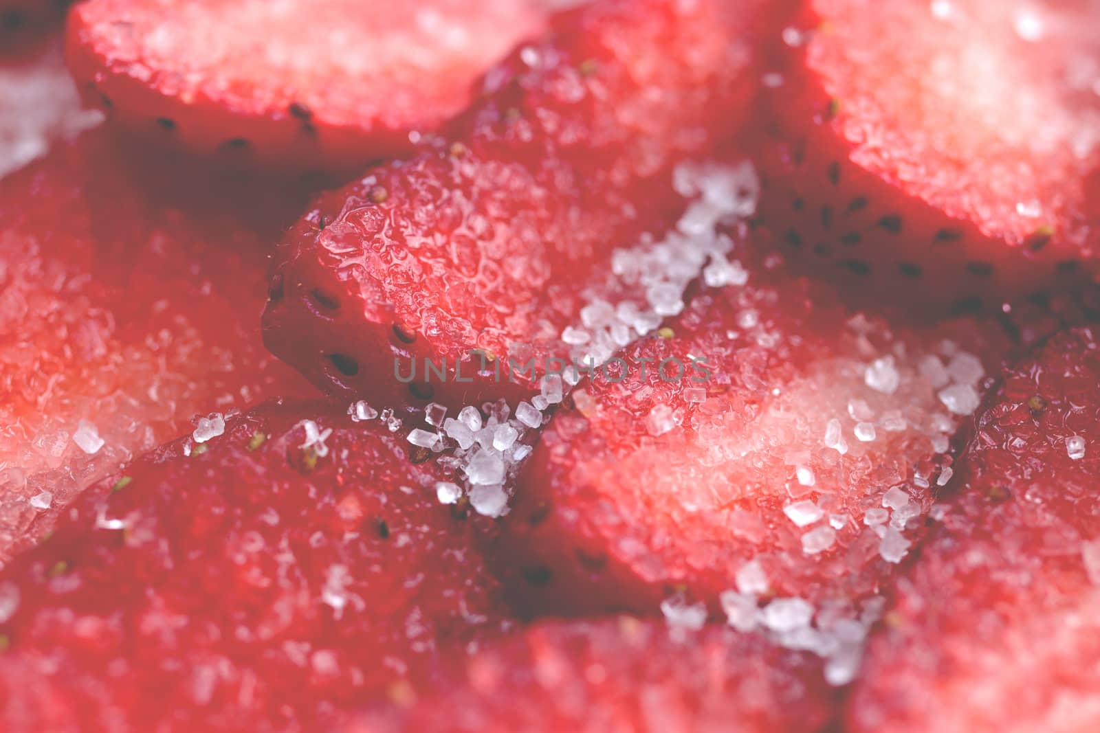 Fresh vitamin berry backdrop. Sliced strawberry in sugar filling background. Red healthy tasty strawberry’s with sugar by sanches812