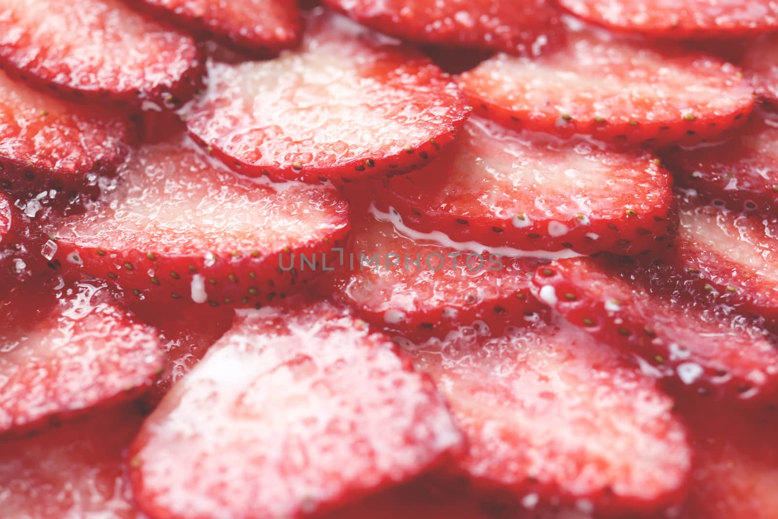 Red healthy tasty strawberry’s with sugar plum texture. Fresh vitamin berry backdrop. Sliced strawberry in sugar cream filling background. by sanches812