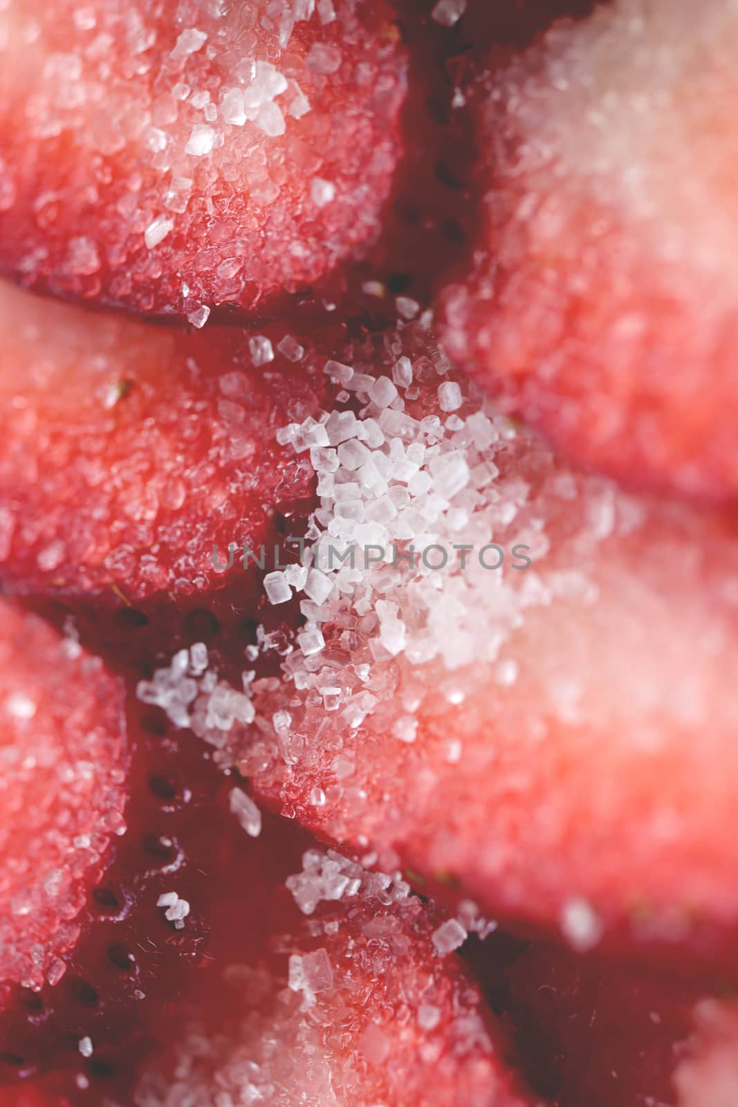 Fresh vitamin berry backdrop. Sliced strawberry in sugar filling background. Red healthy tasty strawberry’s texture.