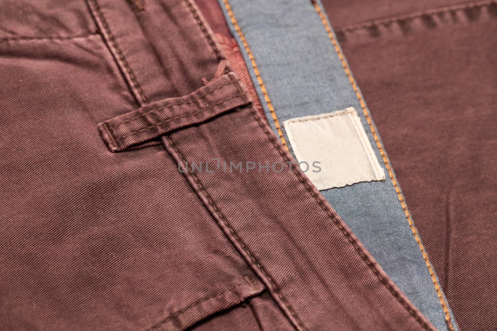 Dark cherry Denim Texture. Denim background of jeans of unusual color, place for text, place for copying.