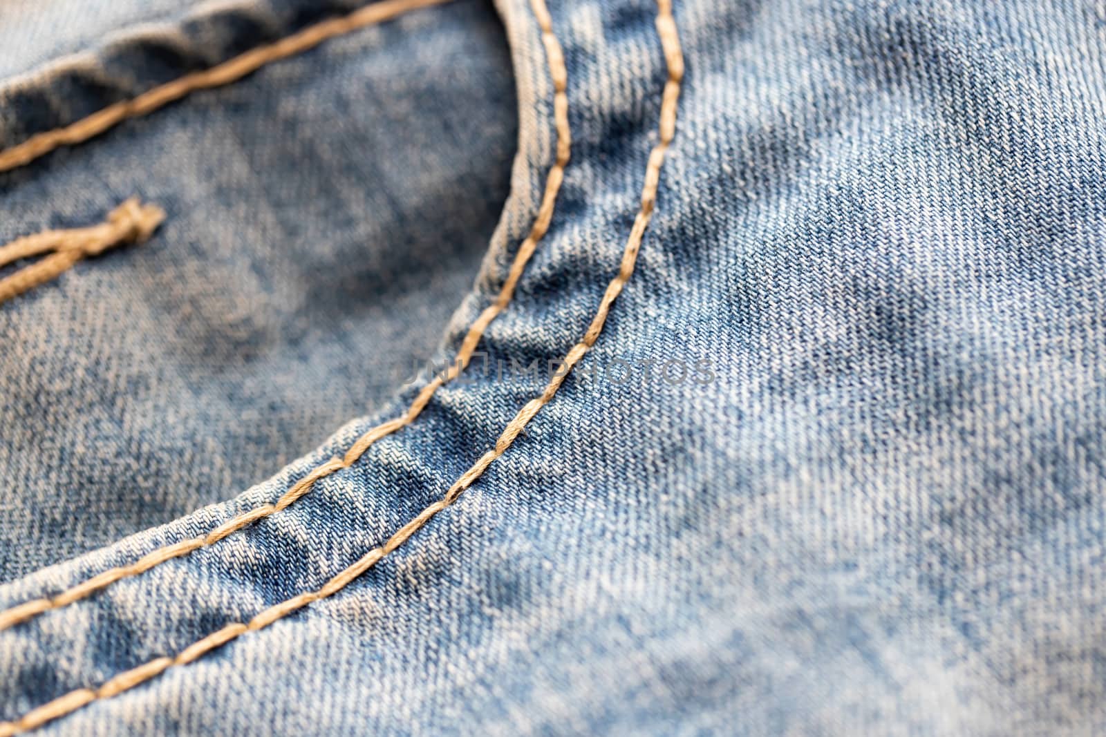 Close-up of blue denim texture. Denim jeans background by bonilook