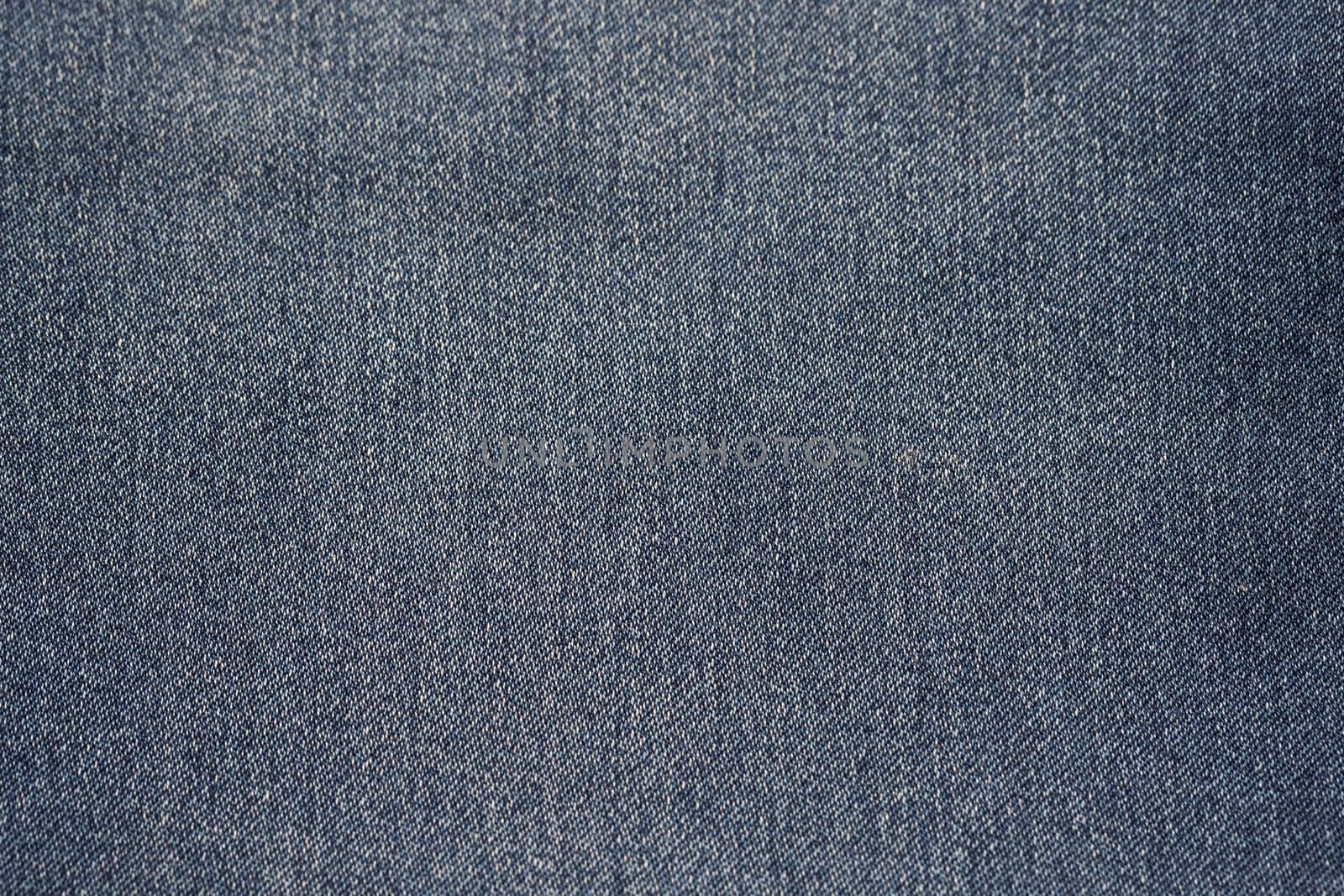 Close-up of blue denim texture. Denim jeans background by bonilook