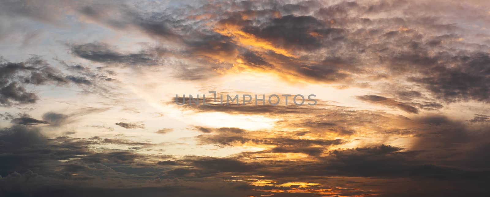 Dramatic sunset clouds on sky in a summer evening