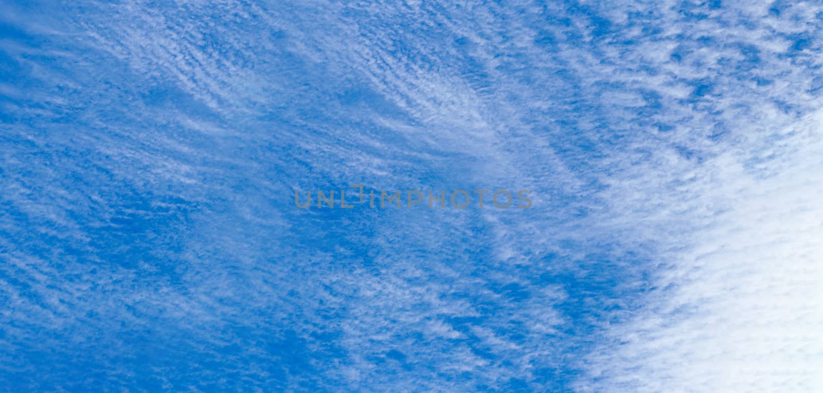 blue sky with clouds with copy space. Light cloudy sky