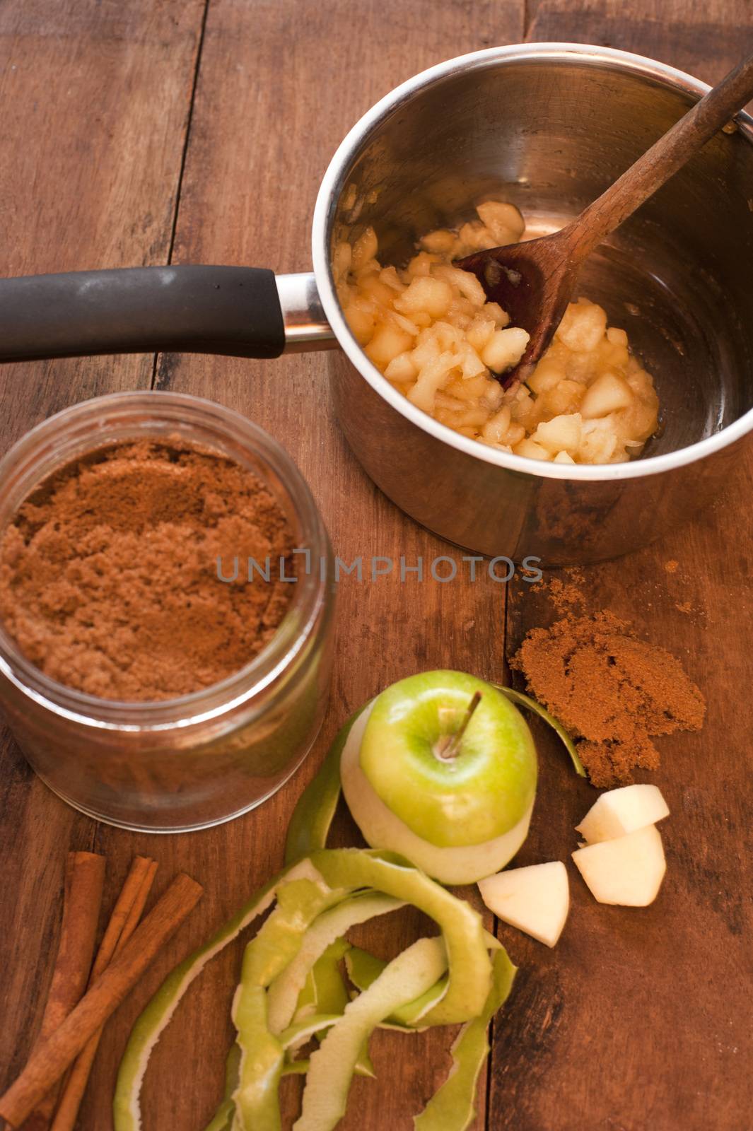 Preparing a tasty apple sauce at home by stockarch