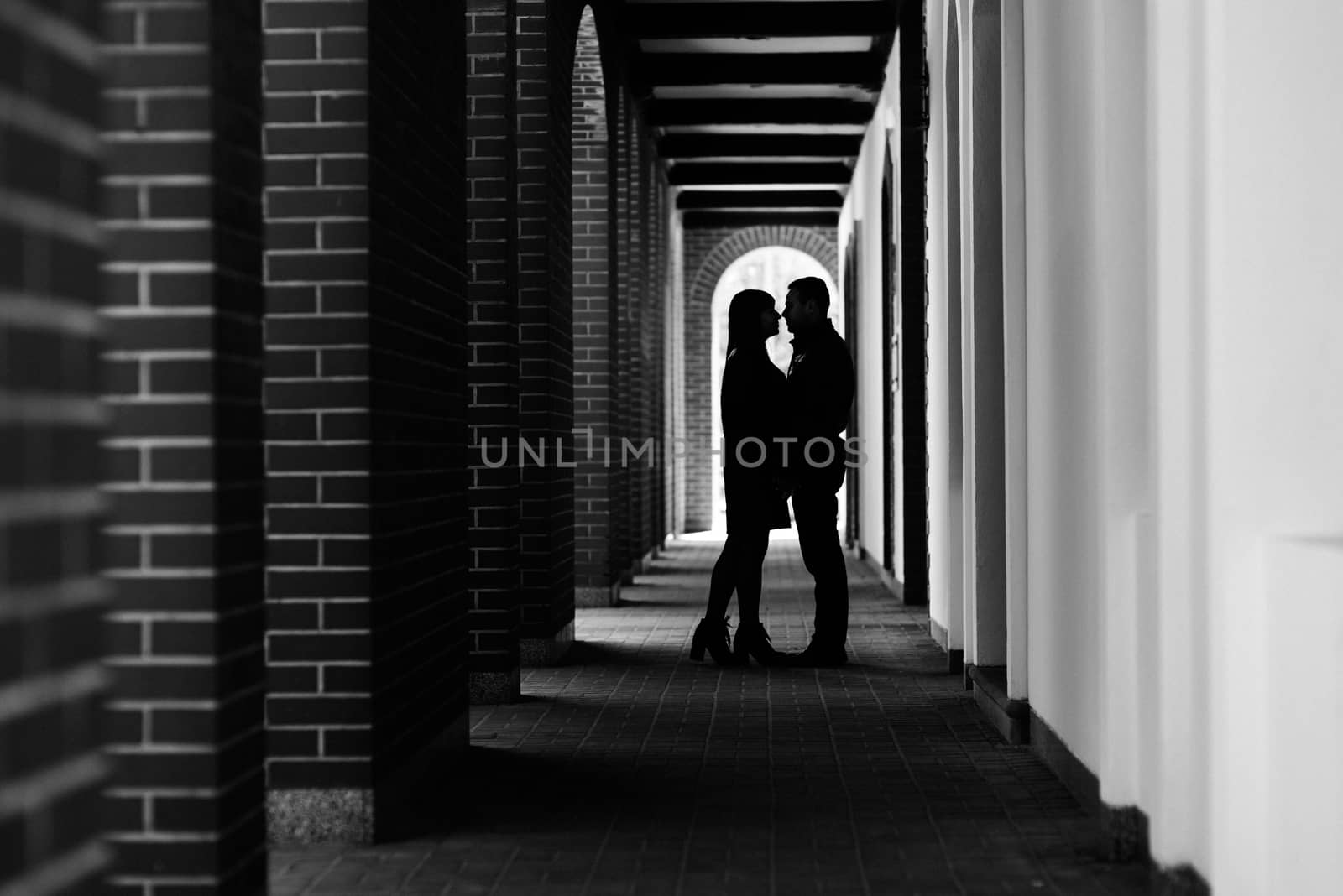 happy guy and girl walking along the tourist streets of old Europe in the city of Gdansk