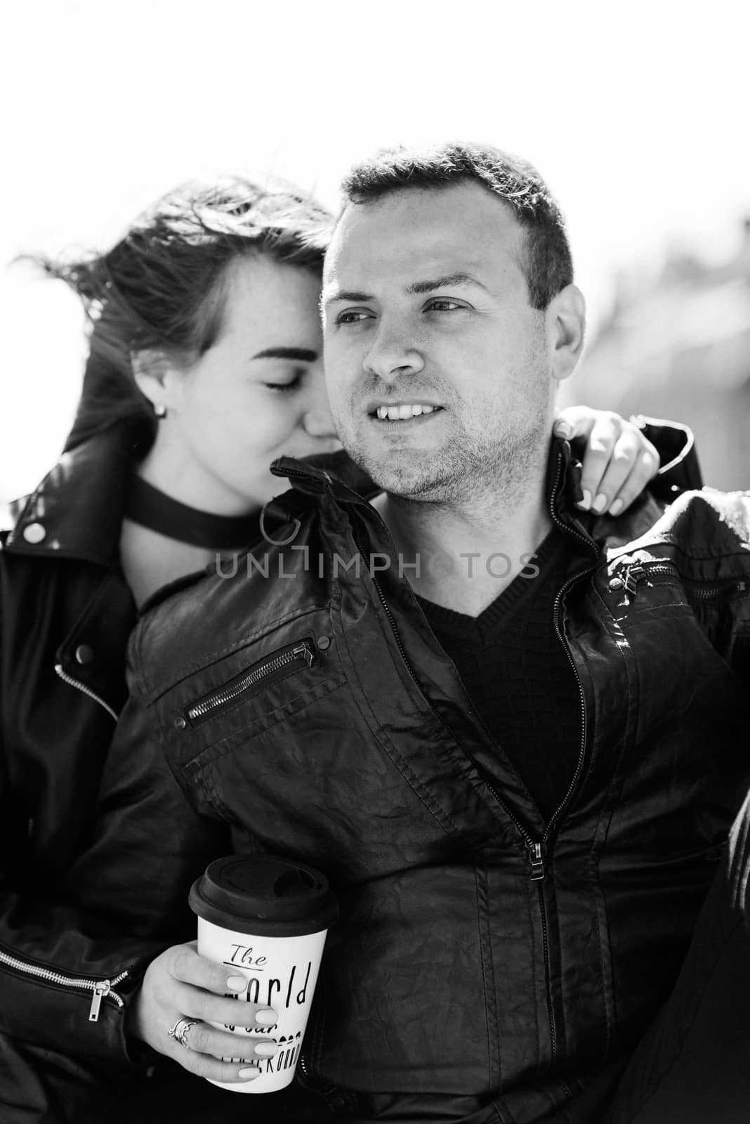 happy guy and girl walking along the tourist streets of old Europe in the city of Gdansk