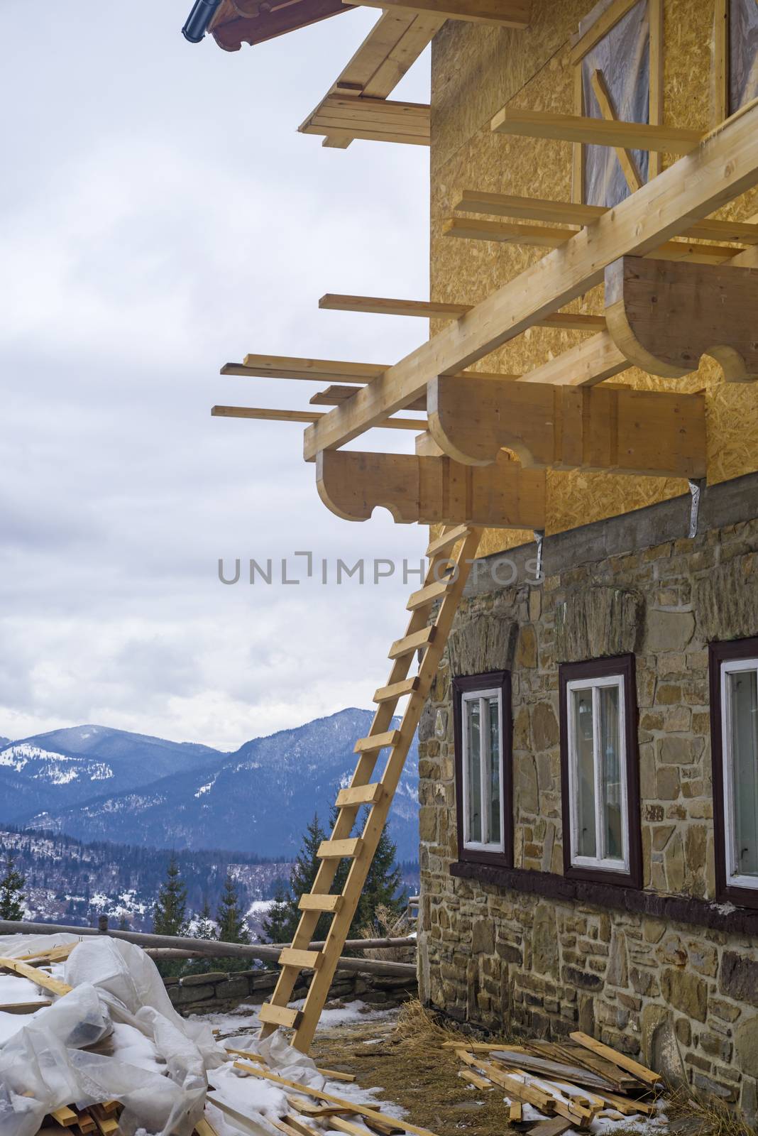 Mountain chalet construction site, exterior working