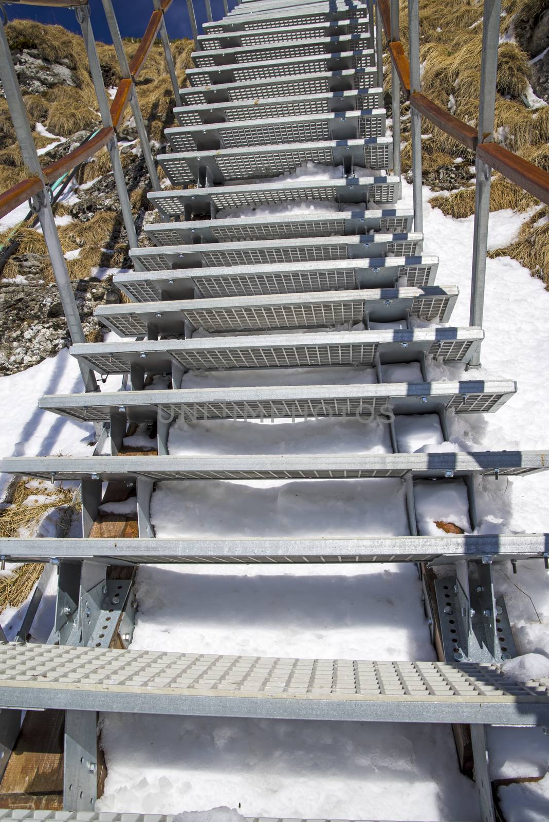 Metal stairs in winter mountain, Romanian Carpathians